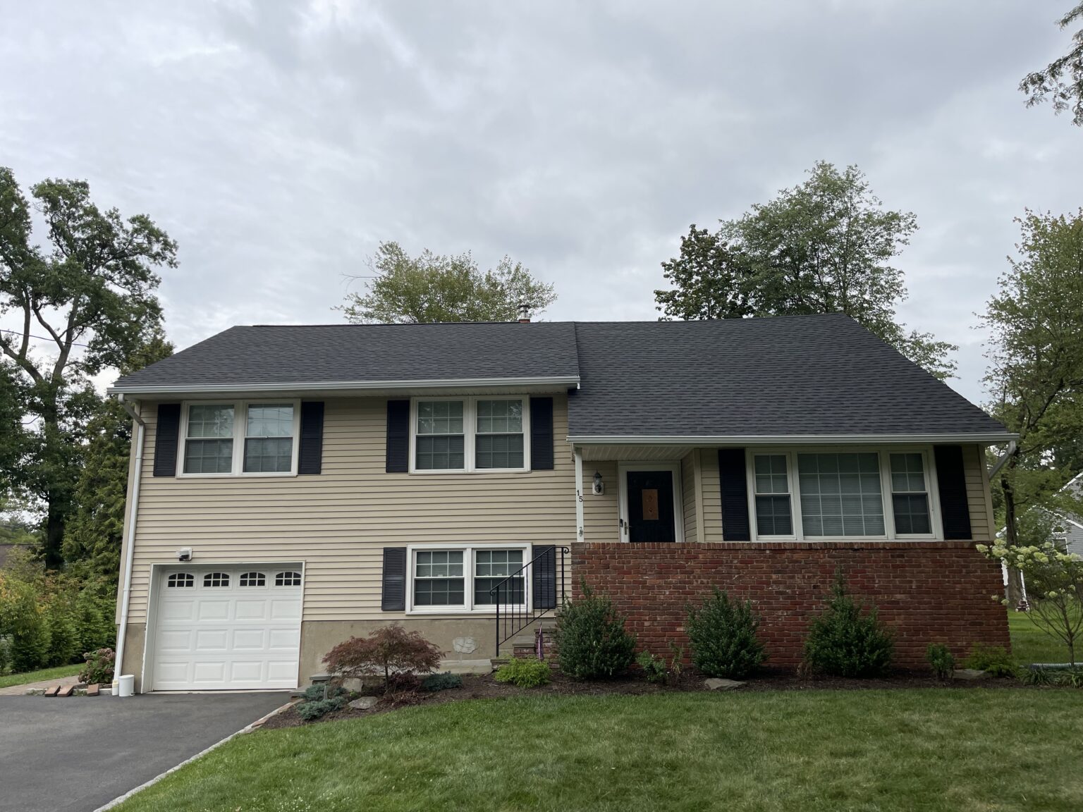 A Golden Master home exterior project with siding and white trim