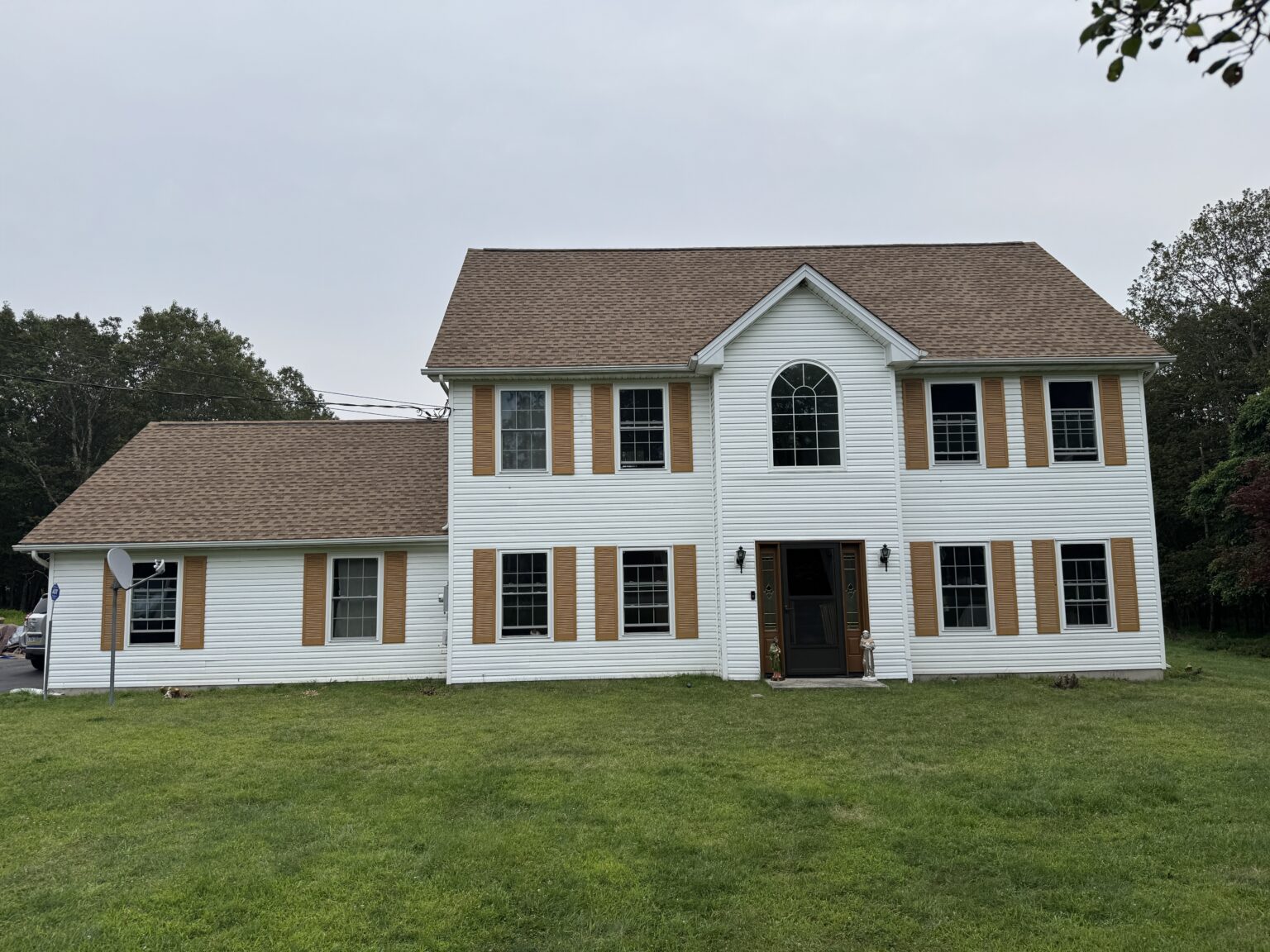 Residential home with shingle roofing and siding