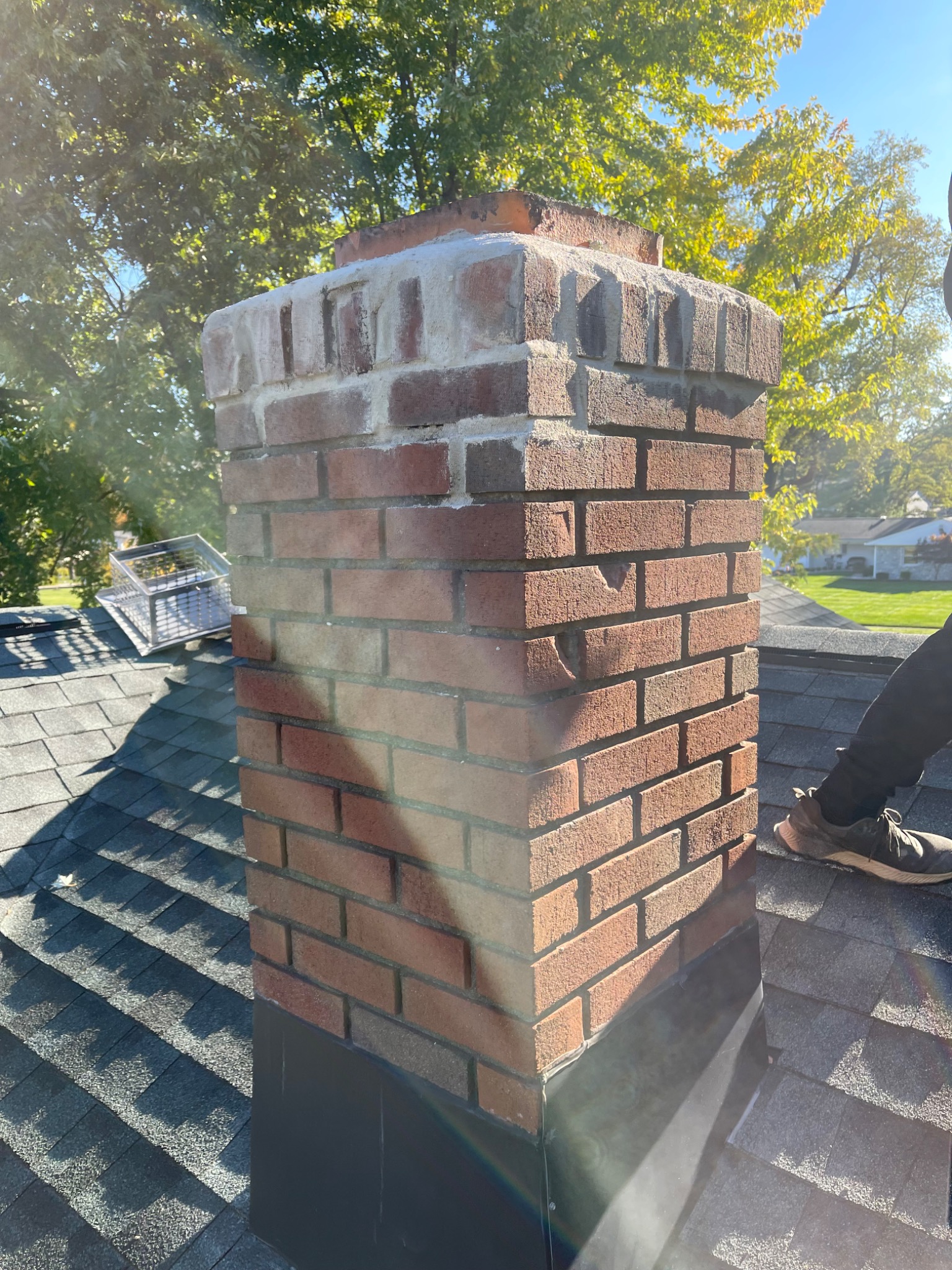 Restored brick chimney and mortar joints from a Golden Master masonry project
