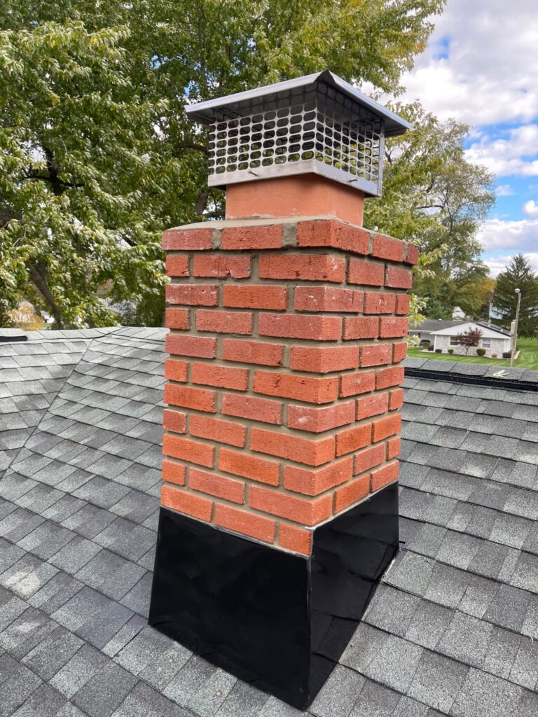 Completed chimney flashing, crown and cap work